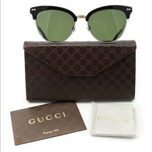 Gucci sunglasses. GG0075S Black/Gold Brand New. Never worn.